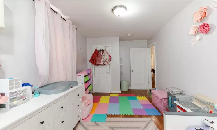 Playroom with light wood-type flooring