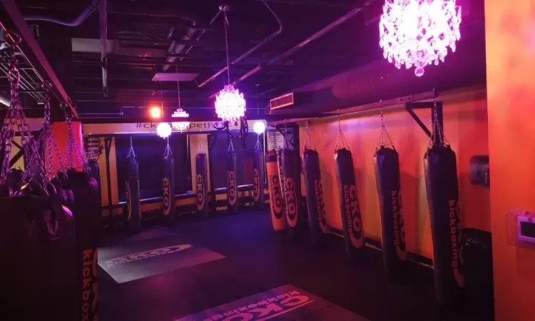 Exercise room featuring a notable chandelier