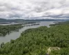 Bird's eye view featuring a water and mountain view