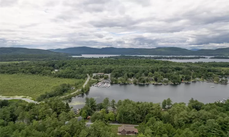 Drone / aerial view with a water and mountain view