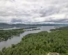 Drone / aerial view with a water and mountain view