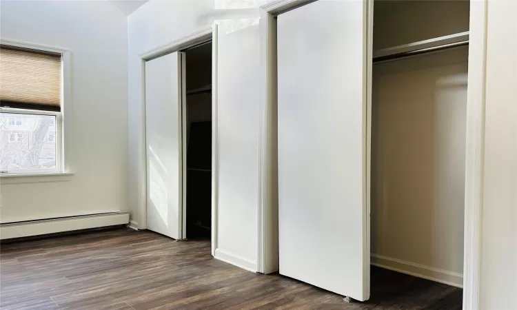 Closet featuring a baseboard radiator