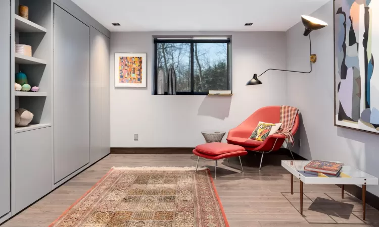 Guest Bedroom featuring built in twin beds and hardwood / wood flooring