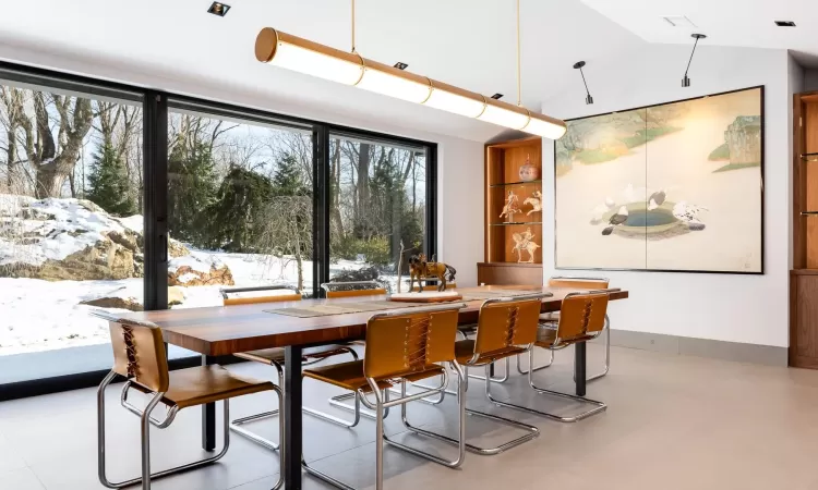 Dining space with vaulted ceiling