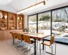 Dining room featuring vaulted ceiling, custom wood millwork