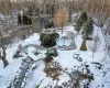 View of snowy Japanese Garden with stream