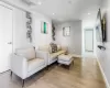 Living room with light hardwood / wood-style flooring