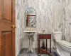 Bathroom with tile walls and toilet