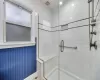 Bathroom with a shower with door