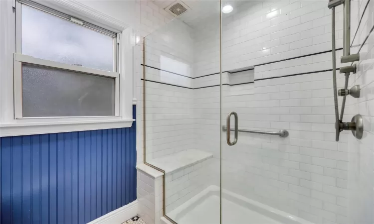 Bathroom with a shower with door