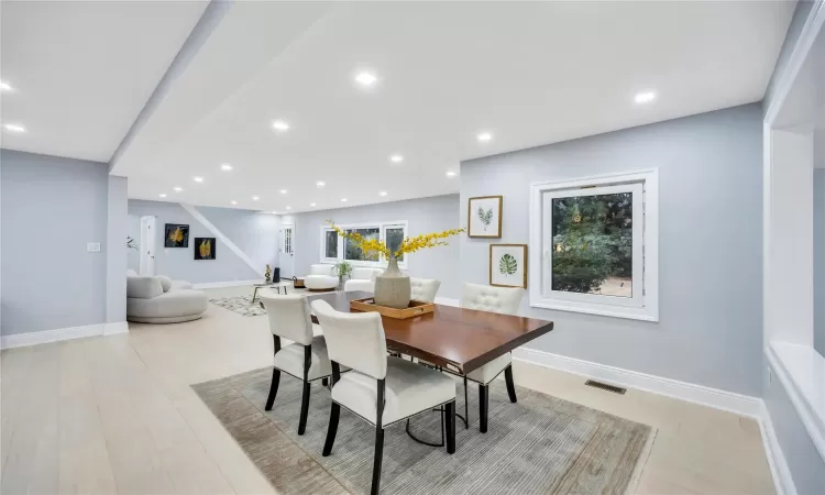 Dining area with light wood-type flooring