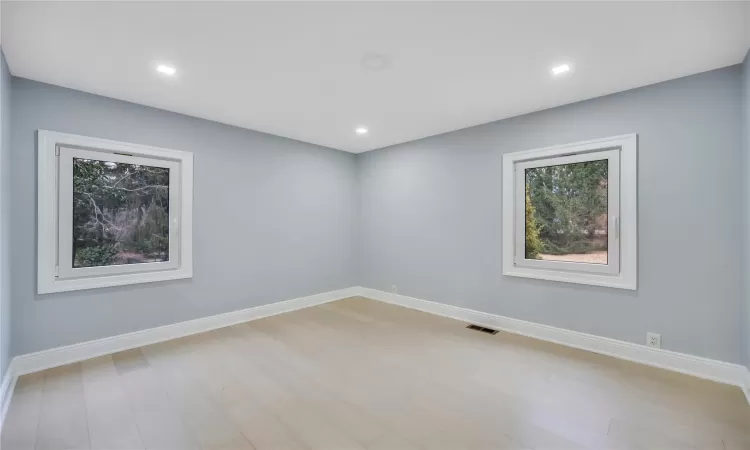 Unfurnished room with light hardwood / wood-style floors