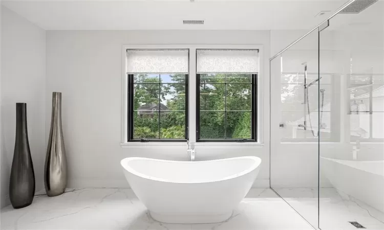 soaking tub overlooking the pool