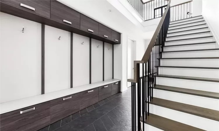 Mudroom featuring dark tile patterned flooring