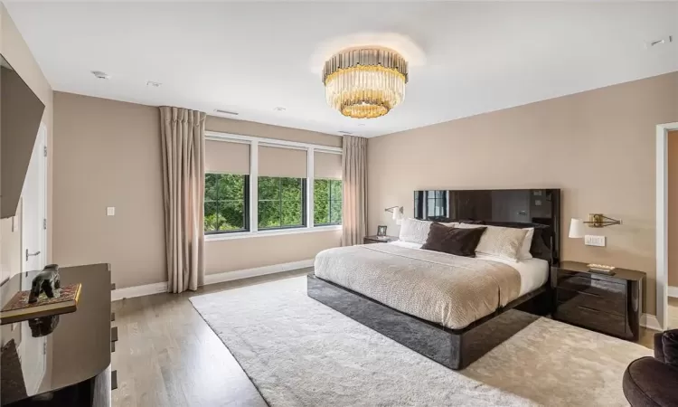 Bedroom featuring huge his and hers walk in closet /dressing room