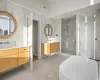 Bathroom featuring high vaulted ceiling, independent shower and bath, and vanity