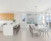 Dining room featuring sink, a chandelier, and wine cooler