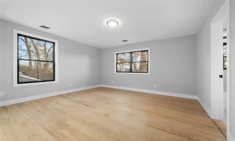 Unfurnished room with light wood-type flooring