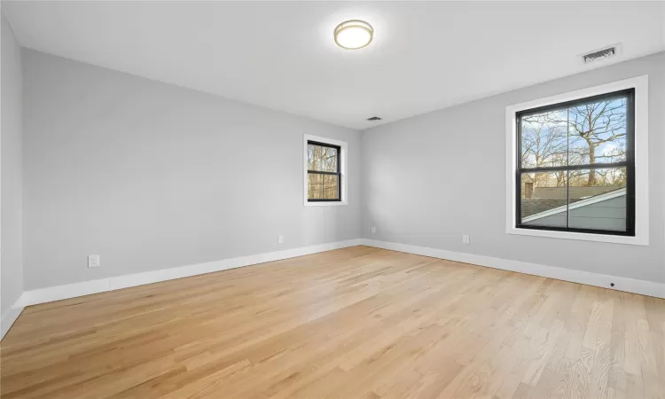 Unfurnished room with light hardwood / wood-style floors