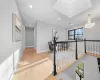 Hallway featuring a notable chandelier and hardwood / wood-style floors