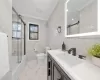 Full bathroom featuring toilet, vanity, tile walls, ornamental molding, and shower / bath combination with glass door