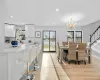 Dining space featuring a chandelier and light wood-type flooring