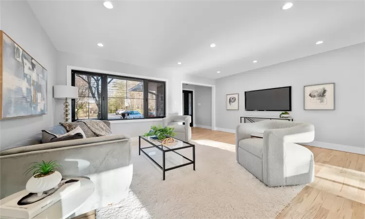 Living room with light wood-type flooring