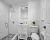 Newly renovated primary bath with frameless stall shower and rain shower head