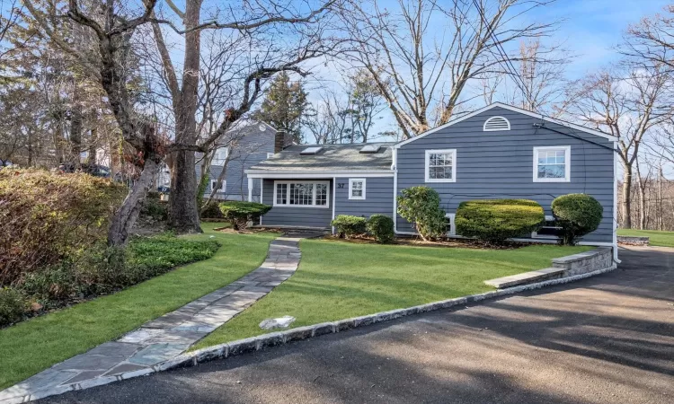 View of front of home featuring a front lawn