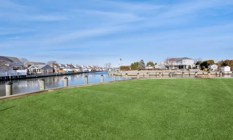 View of yard with a water view