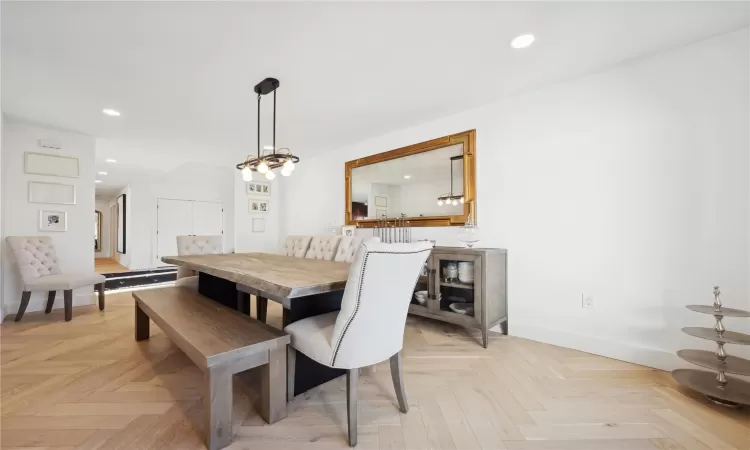 Dining area featuring light parquet floors