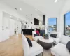 Living room featuring lofted ceiling and light parquet flooring