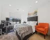 Bedroom featuring light parquet flooring