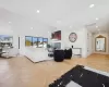 Living room with lofted ceiling and light parquet floors