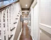 Hall with dark hardwood / wood-style floors