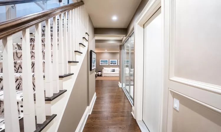 Hall with dark hardwood / wood-style floors