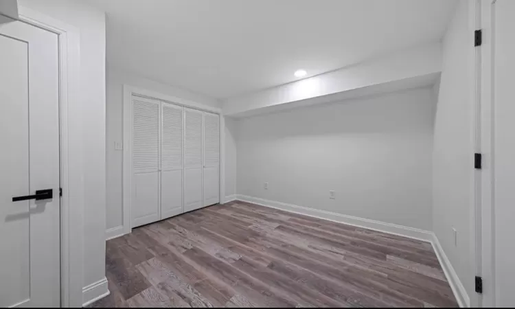 Unfurnished bedroom featuring a closet and light hardwood / wood-style flooring