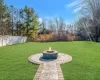 View of yard featuring an outdoor fire pit and a patio area