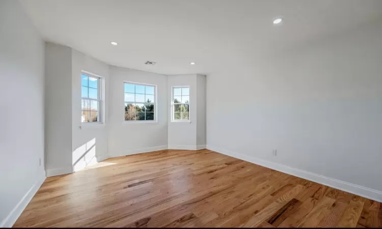 Empty room featuring light hardwood / wood-style flooring