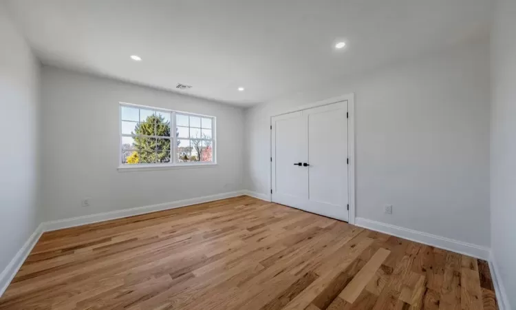 Empty room with light wood-type flooring