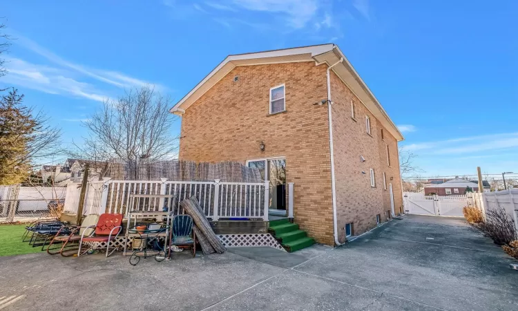 Rear view of house featuring a patio