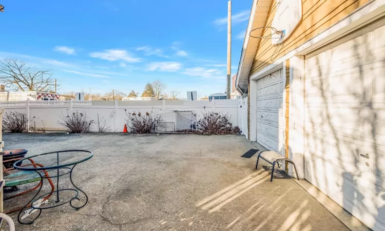 View of patio featuring a garage