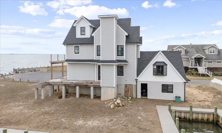 Rear view of property featuring a water view