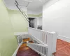 Stairs with tile patterned floors