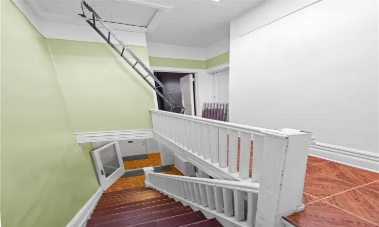 Stairs with tile patterned floors