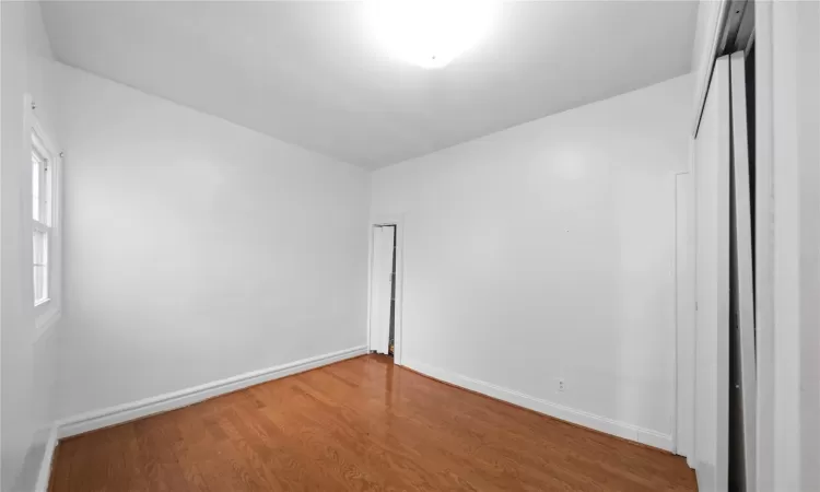 Unfurnished room featuring wood-type flooring