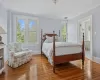 Sitting room featuring a wealth of natural light and hardwood / wood-style floors