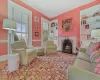 Entryway with an inviting chandelier, ornamental molding, and light hardwood / wood-style flooring