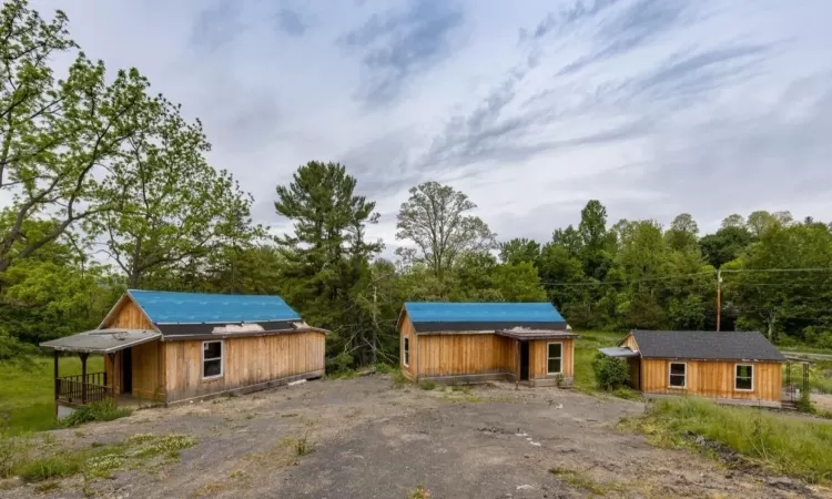 View of front of home with a storage shed