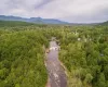 Drone / aerial view with a water and mountain view